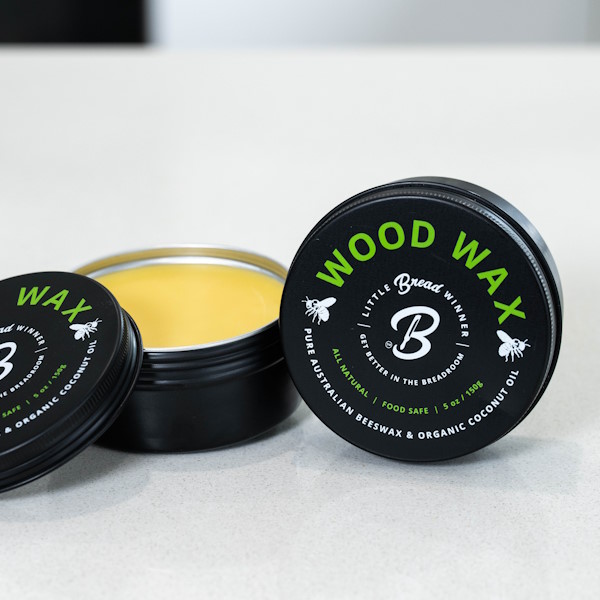 Australian beeswax and organic coconut oil wood wax tin on counter
